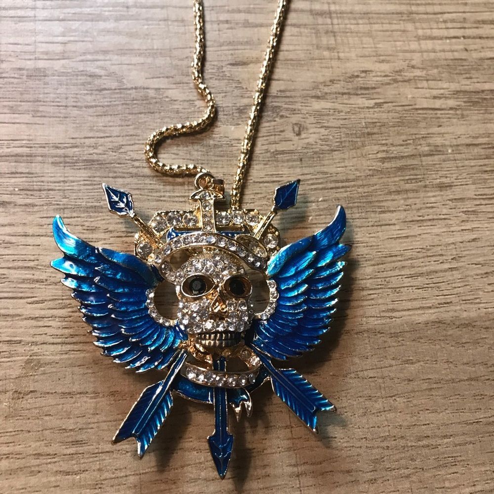 Betsy Johnson Gold Rhinestone Skull Pendant Necklace with Blue Enamel Wings